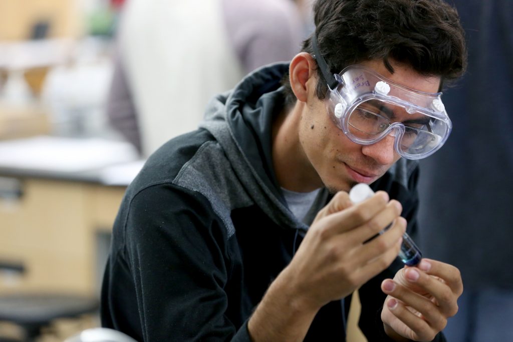 Students work in the lab during Associate Professor Matthew Ray's Chemistry of Materials class An engineering student works on mathematics coursework in Jarvis Hall Thursday, September 28, 2017. Pictured are students examining the products of a crystallization lab where they studied nucleation and growth of single crystalline materials and polycrystalline materials using saturated aqueous ionic solutions of alum, copper sulfate, magnesium sulfate, and iron ammonium sulfate. (UW-Stout Photo by Brett T. Roseman)