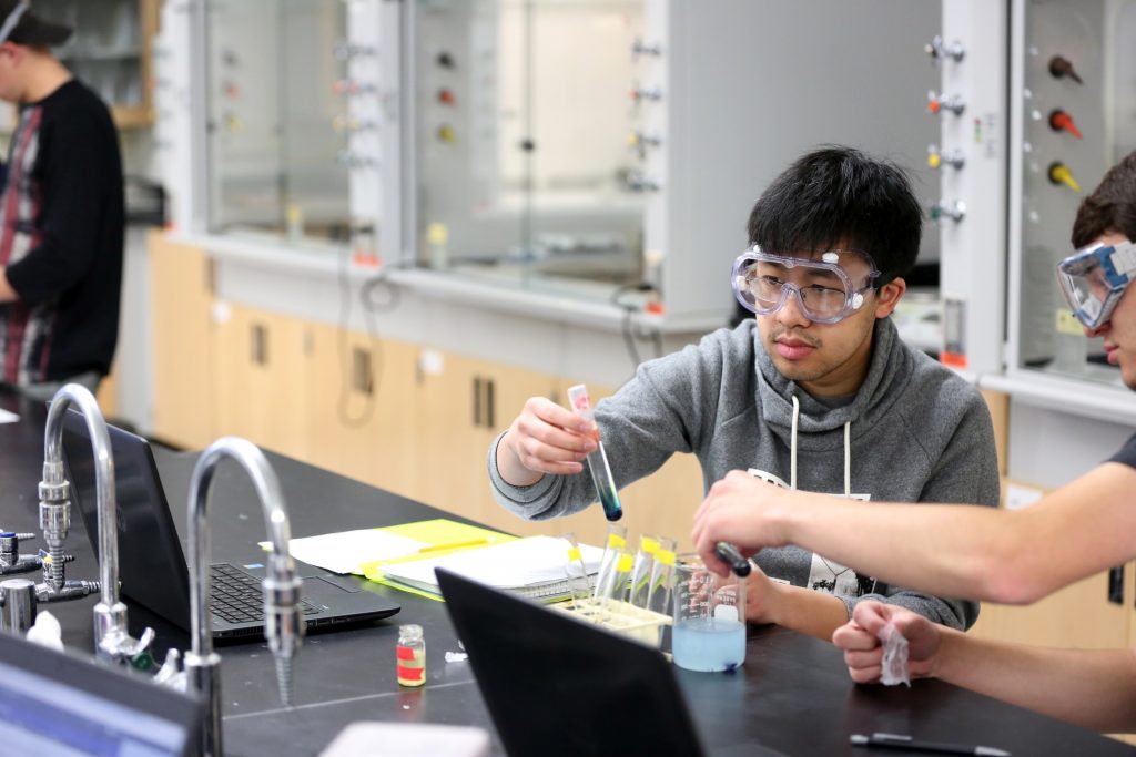 Students work in the lab during Associate Professor Matthew Ray's Chemistry of Materials class An engineering student works on mathematics coursework in Jarvis Hall Thursday, September 28, 2017. Pictured are students examining the products of a crystallization lab where they studied nucleation and growth of single crystalline materials and polycrystalline materials using saturated aqueous ionic solutions of alum, copper sulfate, magnesium sulfate, and iron ammonium sulfate. (UW-Stout Photo by Brett T. Roseman)