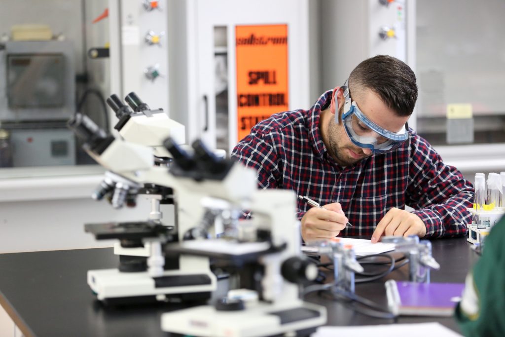 Students work in the lab during Associate Professor Matthew Ray's Chemistry of Materials class An engineering student works on mathematics coursework in Jarvis Hall Thursday, September 28, 2017. Pictured are students examining the products of a crystallization lab where they studied nucleation and growth of single crystalline materials and polycrystalline materials using saturated aqueous ionic solutions of alum, copper sulfate, magnesium sulfate, and iron ammonium sulfate. (UW-Stout Photo by Brett T. Roseman)